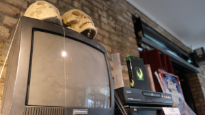 Spooky decorations adorn a television.