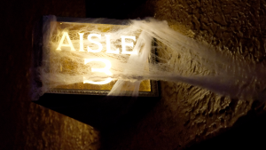 Cobwebs cover an aisle sign in the 700-seat theater.