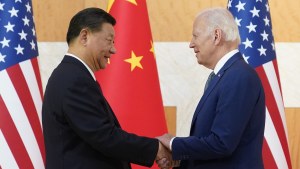 US President Joe Biden, right, and Chinese President Xi Jinping shake hands before their meeting on the sidelines of the G20 summit meeting