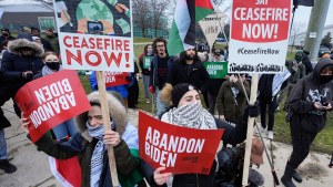 Pro-Palestinian demonstrators march during a visit by President Joe Biden