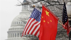 The Capitol dome is seen at rear as Chinese and U.S. flags are displayed in Washington