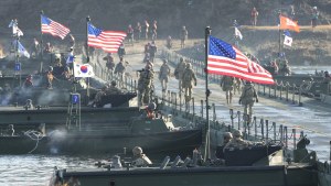 Flags of South Korea and the United States flutter before a joint river-crossing drill between South Korea and the United States